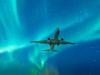 Northern Lights with commercial passenger airplane